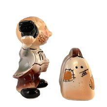Load image into Gallery viewer, Rare vintage hand painted hobo tipping his top hat and suitcase ceramic salt and pepper shakers with corks. Enesco, Japan, 1950s. Add these unique shakers to your collection!

In excellent vintage condition, no chips/cracks/repairs. Original stickers.

Hobo measures 2 1/4 x 1 5/8 x 3 1/4 inches, suitcase measures 2 1/2 x 1 1/4 x 2 inches

