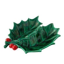Load image into Gallery viewer, Angled view of 1970s handcrafted Christmas holly leaf dish with vibrant retro green and red glaze
