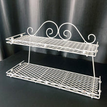Load image into Gallery viewer, Vintage mid-century era, Hollywood Regency metal two tier wire mesh wall shelf in white.  In great vintage condition, some wear to the paint.  Measures 16 1/4 x 5 1/2 x 9 1/2 inches
