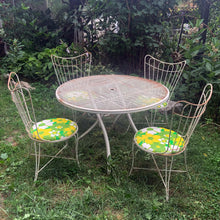 Load image into Gallery viewer, Full set view — Homecrest 1950s wrought iron patio dining set with folding table, 4 chairs and original floral cushions
