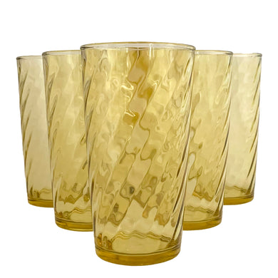 Set of six vintage honey gold swirl optic glass tumblers. Crafted by Continental Can Company, USA, 1960s. Add a touch of colour to your everyday drinkware with these retro glasses!

In excellent condition, no chips.

Measures 2 3/4 x 5 inches

Capacity 12 ounces