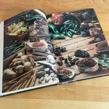 Load image into Gallery viewer, Better Homes and Gardens is known for its fabulous cookbooks. This hardcover cookbook focuses on Hot &amp; Spicy Cooking recipes. Its 96 pages are filled with amazing  recipes along with many colour photographs. Originally published by Meredith Corporation, USA, 1984. This is the fourth printing, 1986.   In great vintage condition with normal age-related yellowing.
