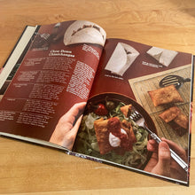 Load image into Gallery viewer, Better Homes and Gardens is known for its fabulous cookbooks. This hardcover cookbook focuses on Hot &amp; Spicy Cooking recipes. Its 96 pages are filled with amazing  recipes along with many colour photographs. Originally published by Meredith Corporation, USA, 1984. This is the fourth printing, 1986.   In great vintage condition with normal age-related yellowing.
