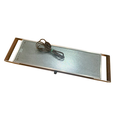 At any family dinner, my grandmother used her vintage Salton Hotray Electric Warming Tray to keep all her yummy dishes hot. Worked like a charm!  In overall excellent vintage condition, no chips or cracks in the glass top. In good working order.  Heated portion measures 22 1/4 x 7 1/2 inches  Overall measures 27 x 7 1/2 inches