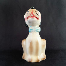 Load image into Gallery viewer, Show off the playful charm of this adorably freckle faced ceramic hound dog figurine! Its wide-eyed expression and pink tongue will add a dash of fun to any room. This beige, tan and black canine features a classic blue bow tie and is sure to charm everyone who sees it!  In excellent condition, free form chips/cracks/repairs. Marked &quot;Japan&quot; on the bottom.  Measures 2 x 4 1/2 inches
