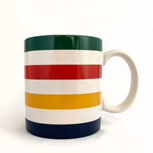 Load image into Gallery viewer, Classic vintage HBC Stripes ceramic coffee tea handled mug. Produced for the Hudson&#39;s Bay, Canada.   In excellent condition, free form chips/cracks. Marked with the HBC logo with the 2 deer stags on their hind legs and the Latin phrase &quot;Pro Pelle Cutem&quot;, meaning “a pelt for a skin”, which is the traditional motto of the Hudson&#39;s Bay Company (HBC). Dishwasher and microwave safe.  Measures 3 1/4 x 3 3/4 inches  Capacity 12 ounces
