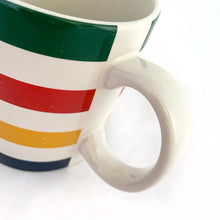 Load image into Gallery viewer, Classic vintage HBC Stripes ceramic coffee tea handled mug. Produced for the Hudson&#39;s Bay, Canada.   In excellent condition, free form chips/cracks. Marked with the HBC logo with the 2 deer stags on their hind legs and the Latin phrase &quot;Pro Pelle Cutem&quot;, meaning “a pelt for a skin”, which is the traditional motto of the Hudson&#39;s Bay Company (HBC). Dishwasher and microwave safe.  Measures 3 1/4 x 3 3/4 inches  Capacity 12 ounces
