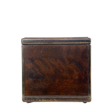 Load image into Gallery viewer, Side view of vintage radio cabinet showing dark wood grain, surface scratches and worn lower trim
