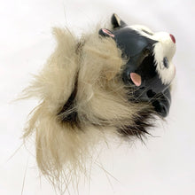 Load image into Gallery viewer, Overhead view of 1950s Napco Originals porcelain skunk figurine showing the real fur tail spread around the body, black and white hand-painted porcelain visible
