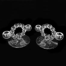 Load image into Gallery viewer, Pair of vintage Candlewick 2-lite candle holders cut by WJ Hughes in his twelve-petalled &quot;Corn Flower&quot; pattern. Glass blanks produced by the Imperial Glass Company, circa 1930. Pairs well with any décor style. Not only would these make a lovely wedding or housewarming gift, the balls lend themselves a string of snowballs which makes them perfect for winter or holiday entertaining. Excellent condition, free from chips. Measures 6 1/2 x 4 1/4 inches
