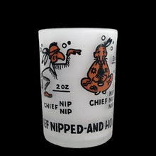 Load image into Gallery viewer, Vintage Chief Nipped and How! liquor measuring glass with 1, 2, 3 and 4 ounce levels with fun graphics/text in dark orange and black on frosted glass. Crafted by Hazel-Atlas Glass, USA. A fun novelty to add to your barware collection!

In excellent condition, free from chips/cracks/wear.

Measures 2 1/8 x 2 7/8 inches
