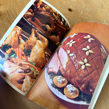 Load image into Gallery viewer, This vintage softcover It's Mainly Because of the Meat Cookbook. There are 145 pages with recipes and colour illustrations and photography. Dominion Stores, Canada, 1969. A handy guide to bring your favourite foods to life!

In excellent vintage condition, appears unused. Age-related foxing/yellowing of the pages.

Measurements 5 3/4 x 9 inches
