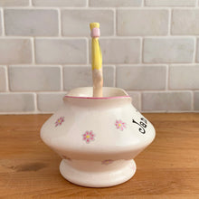 Load image into Gallery viewer, Rare vintage mid-century era Jolly Girls ceramic Jam&#39;n Jelly jar with spoon. Holt Howard, Japan, imported by LIpper and Mann, 1950s. Add this adorable kitschy piece to your collection!

In very good vintage condition, no chips/cracks/repairs, minor discolouration on the underside of the lid where the ceramic stilt pin was placed during firing. Marked Japan.

Measures 3 3/4 x 3 3/4 x 5 1/4 inches
