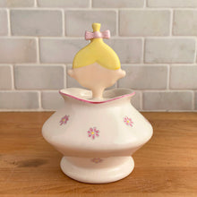 Load image into Gallery viewer, Rare vintage mid-century era Jolly Girls ceramic Jam&#39;n Jelly jar with spoon. Holt Howard, Japan, imported by LIpper and Mann, 1950s. Add this adorable kitschy piece to your collection!

In very good vintage condition, no chips/cracks/repairs, minor discolouration on the underside of the lid where the ceramic stilt pin was placed during firing. Marked Japan.

Measures 3 3/4 x 3 3/4 x 5 1/4 inches
