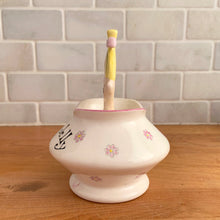 Load image into Gallery viewer, Rare vintage mid-century era Jolly Girls ceramic Jam&#39;n Jelly jar with spoon. Holt Howard, Japan, imported by LIpper and Mann, 1950s. Add this adorable kitschy piece to your collection!

In very good vintage condition, no chips/cracks/repairs, minor discolouration on the underside of the lid where the ceramic stilt pin was placed during firing. Marked Japan.

Measures 3 3/4 x 3 3/4 x 5 1/4 inches
