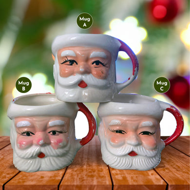 Vintage jolly red and white Santa Claus figural face ceramic mug...nostalgia from holidays gone by! Likely made for Binns Department Store in Pittsburgh, Pennsylvania and crafted in Japan, circa 1960s. Add some holiday magic to your Christmas decor by filling this charming mug with candy canes or top with an ornament!

In as found vintage condition, no chips, cracks or repairs. There is wear to the cold paint on all three mugs. Mugs A and C are marked Japan.

Measures 3 x 3 inches, not incl. handle
