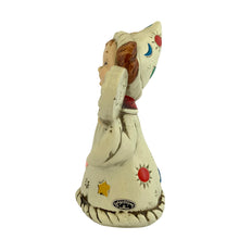 Load image into Gallery viewer, Josef Originals Libra Zodiac wizard figurine, left side profile, showing the back of the cream robe with multicolour celestial motifs including red, blue, teal, and gold stars and moons, brown braided hair, tall white wizard hat, Josef Originals oval sticker visible on lower robe

