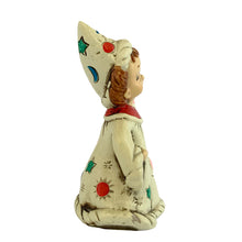 Load image into Gallery viewer, Josef Originals Libra Zodiac wizard figurine, left side profile view, showing the tall white wizard hat with teal stars, blue moon, and red dot motifs, brown braided hair, cream robe with red collar and multicolour celestial details

