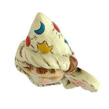 Load image into Gallery viewer, Top-down view of the Josef Originals Libra wizard figurine hat, showing the cream pointed wizard hat decorated with blue crescent moon, red and blue dots, yellow tulip motif, and incised star details, brown hair visible below hat brim
