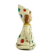 Load image into Gallery viewer, Josef Originals Virgo Zodiac wizard figurine, right side profile view, showing the tall pointed white wizard hat with teal stars, red dot, and blue crescent moon motifs, brown braided hair, cream robe with red suns and teal stars, yellow collar
