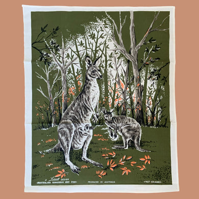 Vintage silk screened natural linen tea towel featuring an adorable kangaroo and joey standing in a forest clearing. The design is highly detailed in shades of avocado green, orange, gray, black and white. Crafted by Liddell Designs, Australia, 1960s. Tea towels make great practical kitchen and wall decor. A towel of this quality and style would make a wonderful contemporary pillow!

In excellent condition. Appears unused.

Approximately 23 1/4 x 28 1/2 inches