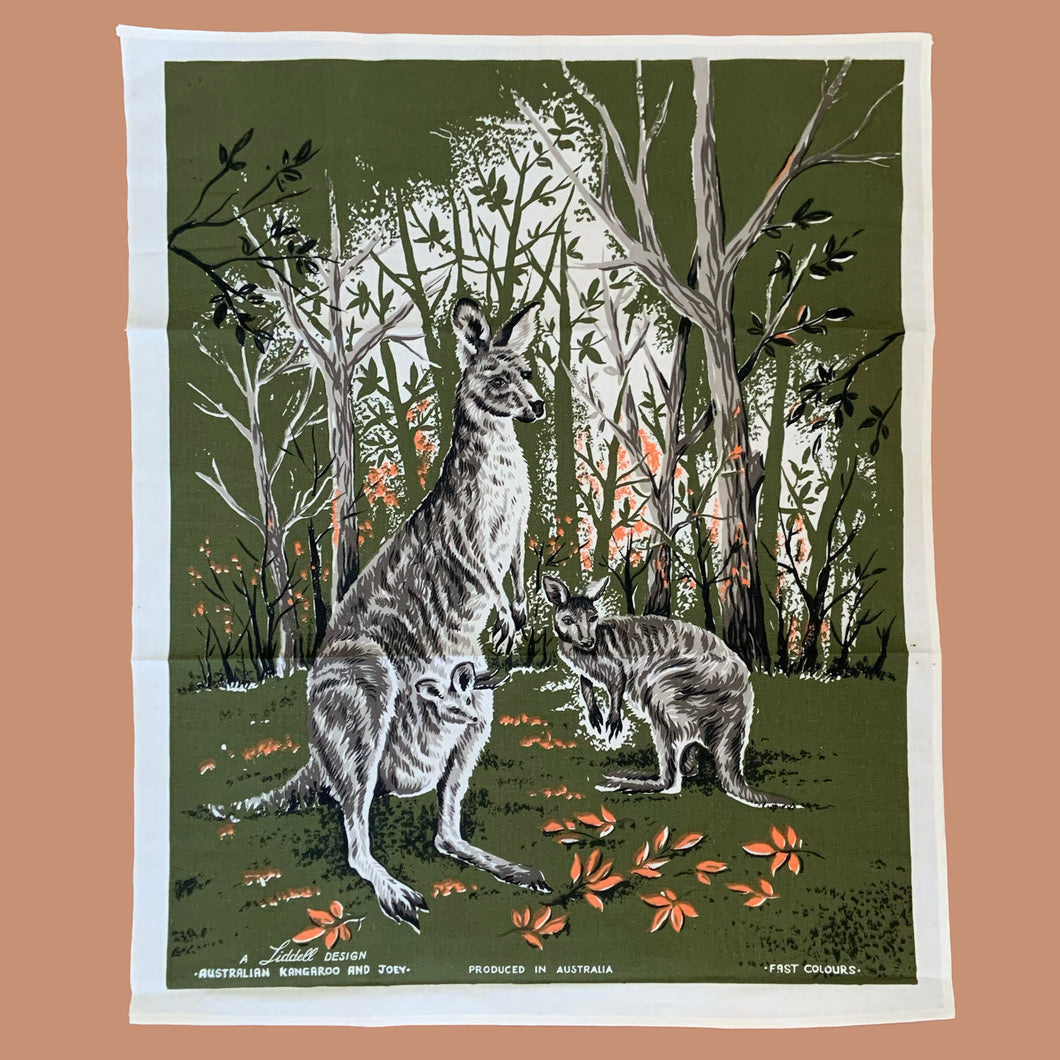 Vintage silk screened natural linen tea towel featuring an adorable kangaroo and joey standing in a forest clearing. The design is highly detailed in shades of avocado green, orange, gray, black and white. Crafted by Liddell Designs, Australia, 1960s. Tea towels make great practical kitchen and wall decor. A towel of this quality and style would make a wonderful contemporary pillow!

In excellent condition. Appears unused.

Approximately 23 1/4 x 28 1/2 inches