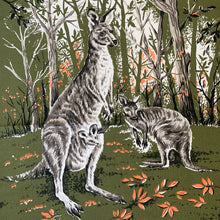 Load image into Gallery viewer, Vintage silk screened natural linen tea towel featuring an adorable kangaroo and joey standing in a forest clearing. The design is highly detailed in shades of avocado green, orange, gray, black and white. Crafted by Liddell Designs, Australia, 1960s. Tea towels make great practical kitchen and wall decor. A towel of this quality and style would make a wonderful contemporary pillow!

In excellent condition. Appears unused.

Approximately 23 1/4 x 28 1/2 inches
