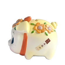 Load image into Gallery viewer, This adorable kitschy vintage Kawaii white piggy bank features a big eyed smiling face with pink bow, glittery flowers and curly tail. Crafted by Sanrio, Japan, 1980s. A wonderful collectible decor piece!

In great vintage condition, no chips or cracks. Black rubber stopper is intact.

Measures 3 1/2 x 2 3/4 x 3 inches
