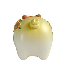 Load image into Gallery viewer, This adorable kitschy vintage Kawaii white piggy bank features a big eyed smiling face with pink bow, glittery flowers and curly tail. Crafted by Sanrio, Japan, 1980s. A wonderful collectible decor piece!

In great vintage condition, no chips or cracks. Black rubber stopper is intact.

Measures 3 1/2 x 2 3/4 x 3 inches
