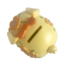 Load image into Gallery viewer, This adorable kitschy vintage Kawaii white piggy bank features a big eyed smiling face with pink bow, glittery flowers and curly tail. Crafted by Sanrio, Japan, 1980s. A wonderful collectible decor piece!

In great vintage condition, no chips or cracks. Black rubber stopper is intact.

Measures 3 1/2 x 2 3/4 x 3 inches
