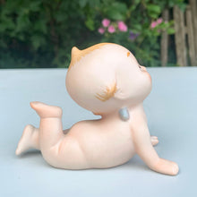 Load image into Gallery viewer, Sweet vintage bisque porcelain Kewpie doll figurine with blue wings, model KW7546. Crafted by Lefton, Japan, circa 1960s. This darling Kewpie figurine is laying down on his tummy, pushed up on its hands looking skyward with one leg curled up. So cute!  In excellent condition, no chips/cracks/repairs.  Measures 3 1/4 x 2 3/4 x 2 1/2 inches
