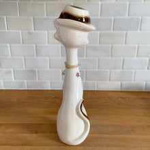 Load image into Gallery viewer, Vintage kitsch long neck, big eyed hand painted ceramic cat figurine. Crafted in Japan, 1960s. An adorable piece to add to your kitsch or cat collection!

In excellent vintage condition, no chips/cracks/repairs. There is minor glaze miss on the hat brim.

Measures 3 x 3 3/4 x 12 1/2 inches
