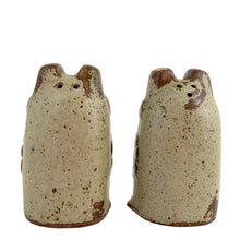 Load image into Gallery viewer, Rear view of vintage Knobler frog salt and pepper shakers styled on a table surface, showing scale and decorative context
