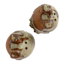 Load image into Gallery viewer, Overhead view of Knobler frog salt and pepper shakers, three-quarter view showing raised floral motif and textured stoneware glaze detail

