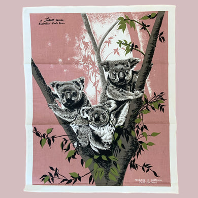 Vintage silk screened natural linen tea towel featuring a group of adorable koala bears in a eucalyptus tree. The design is highly detailed in shades of deep rose, green, gray, black and white. Crafted by Liddell Designs, Australia, 1960s. Tea towels make great practical kitchen and wall decor. A towel of this quality and style would make a wonderful contemporary pillow!

In excellent condition. Appears unused.

23 1/2 x 29 inches