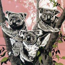 Load image into Gallery viewer, Vintage silk screened natural linen tea towel featuring a group of adorable koala bears in a eucalyptus tree. The design is highly detailed in shades of deep rose, green, gray, black and white. Crafted by Liddell Designs, Australia, 1960s. Tea towels make great practical kitchen and wall decor. A towel of this quality and style would make a wonderful contemporary pillow!

In excellent condition. Appears unused.

23 1/2 x 29 inches
