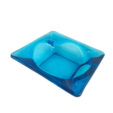 Load image into Gallery viewer, Vintage mid-century laser blue square glass ashtray would make a great addition to your lounge or barware collection. Crafted by Anchor Hocking, USA, 1957 - 1965. The colour is out of this world!

In excellent condition, no chips or cracks.

Measures 4 1/8 x 4 1/8 inches
