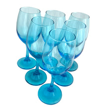 Load image into Gallery viewer, Six Libbey Laser Blue stemmed wine glasses fanned diagonally, open rims angled toward camera, aqua-blue glass catching light

