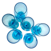Load image into Gallery viewer, Overhead view of six Libbey Laser Blue wine glasses inverted, showing circular bases and stem nubs in vivid aqua blue
