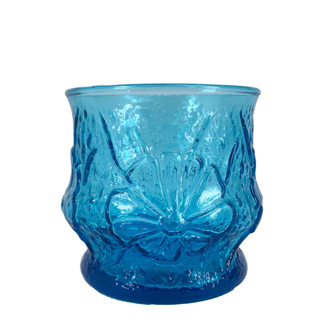 Striking laser blue Rainflower old fashioned glass feature a textured raised floral design. Crafted by Anchor Hocking, USA, 1960s. The perfect vintage accent to brighten your tablescape!

In excellent condition, no chips or wear.

Measures 3 1/8 inches