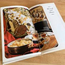 Load image into Gallery viewer, Laura Secord is known for its fabulous confections and in a joint effort with the Canadia Hoe Economics Assocation they created this quintessential Canadian cook book featuring authentic Canadian recipes from across the country. Its 192 pages are filled with wonderful recipes along with many colour illustrations (Frank Neufeld. Published by McClelland and Stewart Ltd. Canada, 1966. This is the fifth edition 1971.   In great vintage condition with normal age-related yellowing.   
