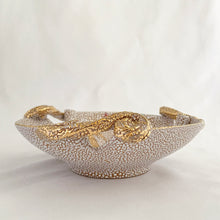 Load image into Gallery viewer, A fabulous piece of Bitossi mid-century lava pebble glazed pottery dish featuring a gold butterfly and three decorative scrolled and curled handles. Artisan crafted in Italy, and imported to North America by Irving Richards of Raymor, USA, circa 1960s. Makes a lovely trinket or candy dish. A phenomenal gift for the MCM lover. Excellent condition, free from chips/cracks/repairs. Marked Italy. Measures 6 1/2 x 2 3/8 inches
