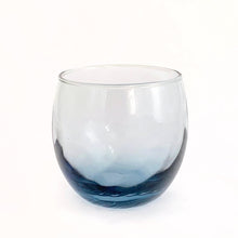 Load image into Gallery viewer, We are digging the swirl optic and smokey blue colour of these vintage &quot;Tiara Bleu&quot; roly poly cocktail glasses. Set of six. Produced by the Libbey Glass Company, circa 1970. These glasses appeared on page 10 of the 1970 Pacesetter catalog. Your bar cart and guests will thank you.....cheers!   In excellent condition, no chips or cracks. Marked on the bottom with the Libbey &quot;L&quot;. Stackable for better storage.  Each glass measures 3 1/4 x 3 1/2 inches  Capacity 11 ounces
