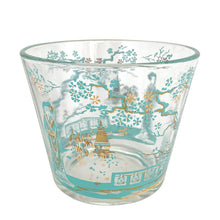 Load image into Gallery viewer, Libbey Glass Chinoiserie ice bucket, three-quarter front view showing full turquoise and gold geisha garden scene with pagoda, cherry blossom branches, and lattice fence on clear glass, Canada 1950s–60s
