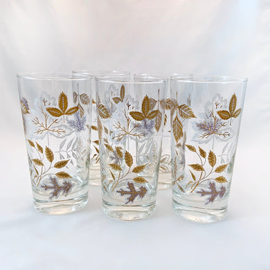 Vintage mid century highball glass decorated with 22kt gold, lilac purple and white leaves. Crafted by Libbey, USA, circa 1950s. These beauties have stood the test of time! 

In excellent condition, no chips or wear.

Measures 2 3/4 x 5 1/2 inches

Capacity 9 ounces