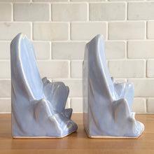 Load image into Gallery viewer, Striking vintage matte lilac water lily bookends. Crafted by Nelson McCoy Pottery, 1940s. These rare bookends are a must for any McCoy art pottery collector!

In as found vintage condition, with a couple of chips, see photos. Maker&#39;s marks on both pieces.

Measures 6 1/4 x 5 1/2 inches
