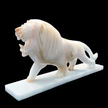 Load image into Gallery viewer, Beautifully hand carved vintage mid-century onyx marble roaring standing lion statue on a rectangular base. This heavy statue would look amazing sitting atop atop of a stack of books or as a book end, or as a standalone piece of decor.  In vintage condition with wear at the corners and there is a small chips at the corner of its mouth, see photos  Measures 12 5/8 x 2 1/2 x 6 5/8 inches
