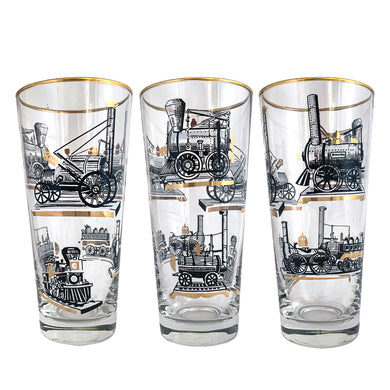 Set of seven vintage pint glasses featuring black, white and gold locomotive trains. Crafted by Libbey Glass, circa 1950s. A great addition to your barware collection or perfect for the train enthusiast!  In excellent condition, no chips. Marked on the bottom with the Libbey 