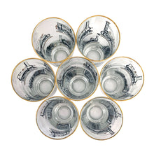 Load image into Gallery viewer, Set of seven vintage pint glasses featuring black, white and gold locomotive trains. Crafted by Libbey Glass, circa 1950s. A great addition to your barware collection or perfect for the train enthusiast!  In excellent condition, no chips. Marked on the bottom with the Libbey &quot;L&quot;.  Measures 3 1/8 x 6 1/2 inches  Capacity 16 ounces
