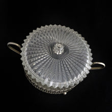 Load image into Gallery viewer, Clear faceted lucite plastic lidded vanity box nestled in a silver ormolu handled caddy. The silver-toned metal ormolu caddy has two handles and three ball feet. An excellent addition to your boudoir or bathroom vanity for powder or trinkets. In excellent vintage condition, free from chips. Measures 5 1/8 x 3 1/2 (not incl. handles)

